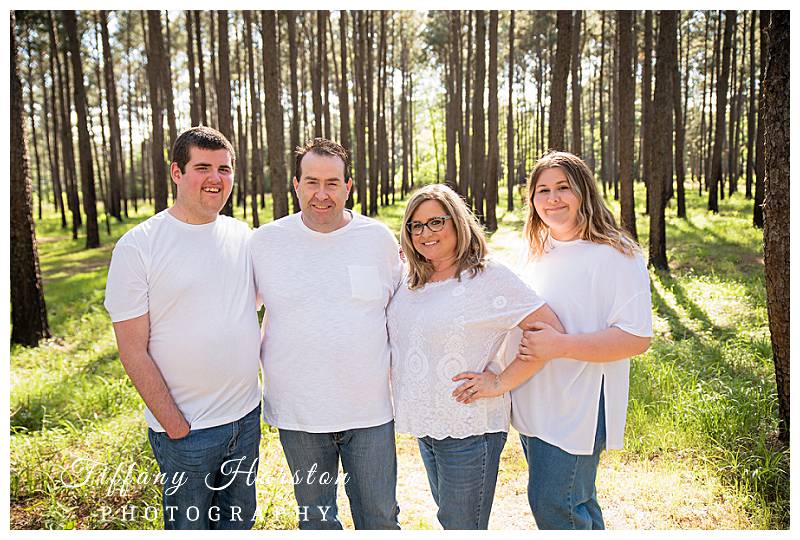 houston family photographer taking pictures in woodlands forrest